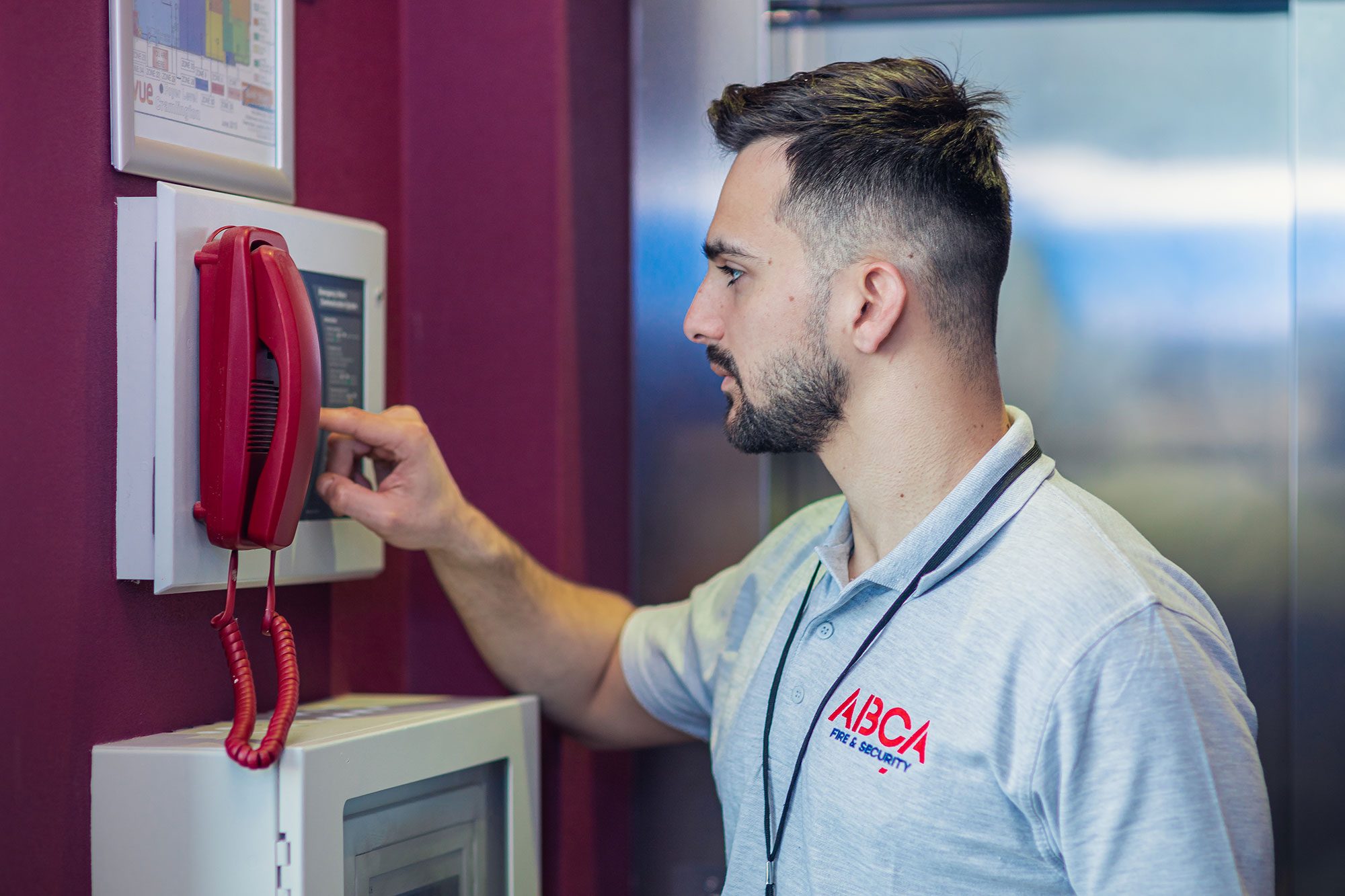 ABCA engineer testing a fire alarm panel